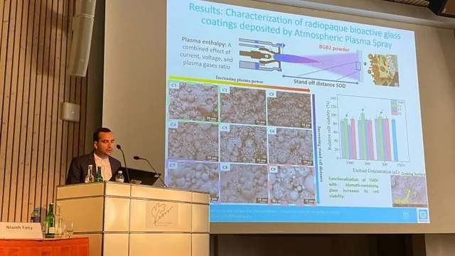 Speaker presenting plasma-sprayed coating results at EORS 2025.